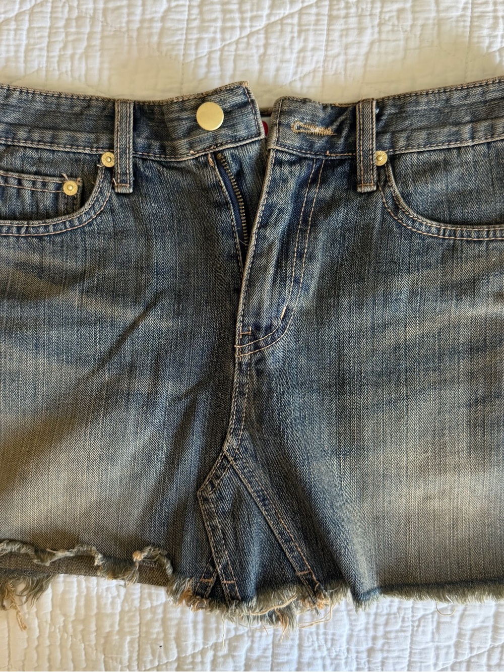 Washed Blue Denim Mini Skirt with Frayed Hem